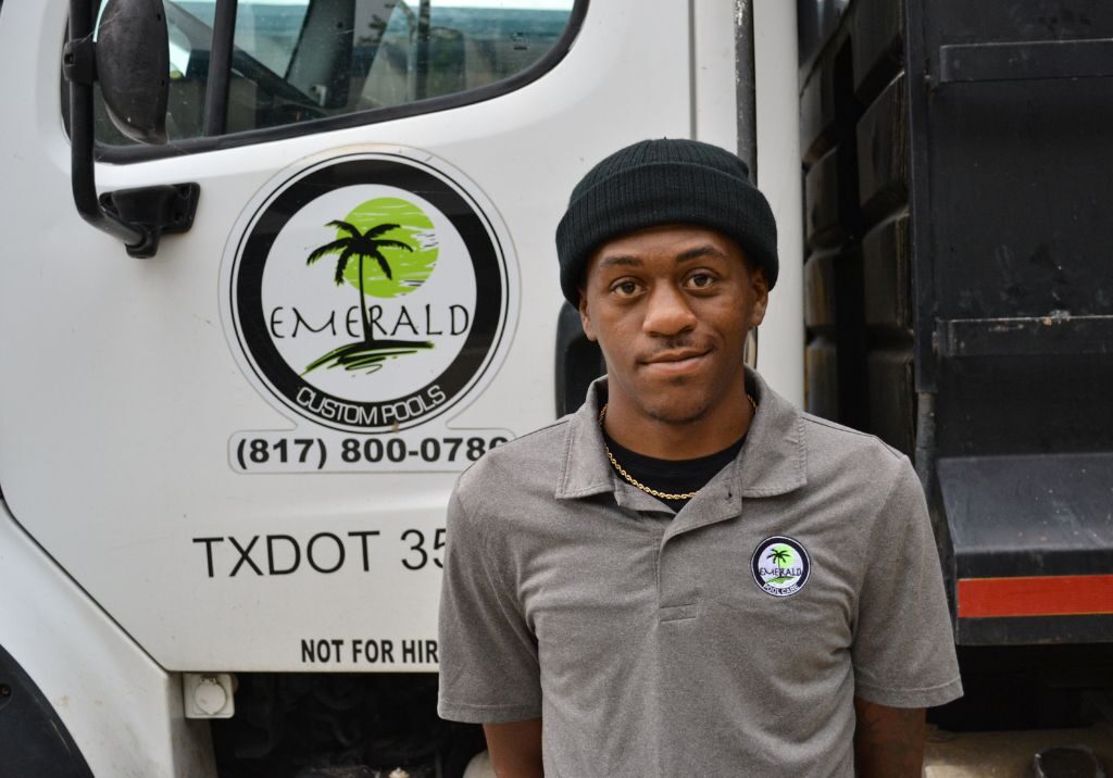 Mark Man standing in front of construction truck