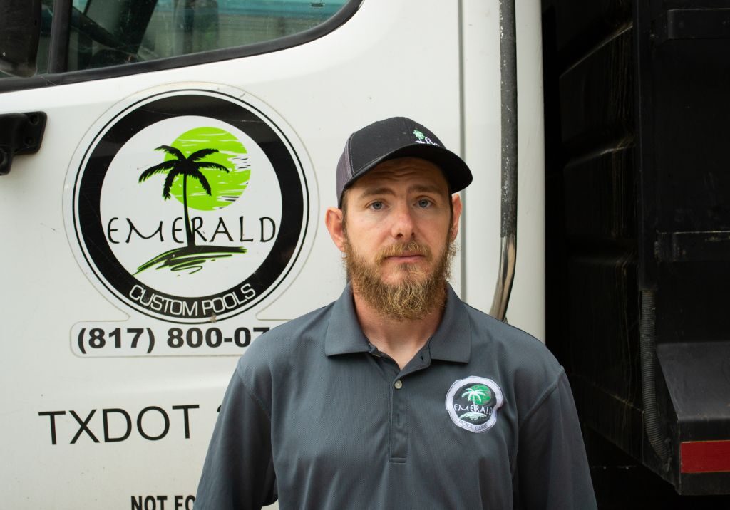 Cody Man standing in front of construction truck