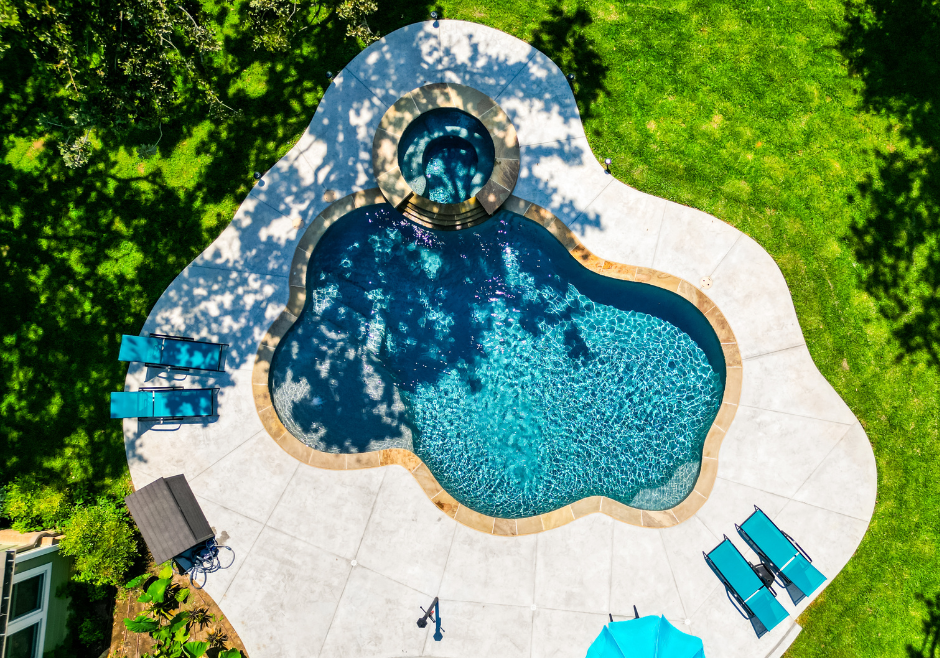aerial view of a custom pool and hot tub after completion of the pool building process with a custom pool builder