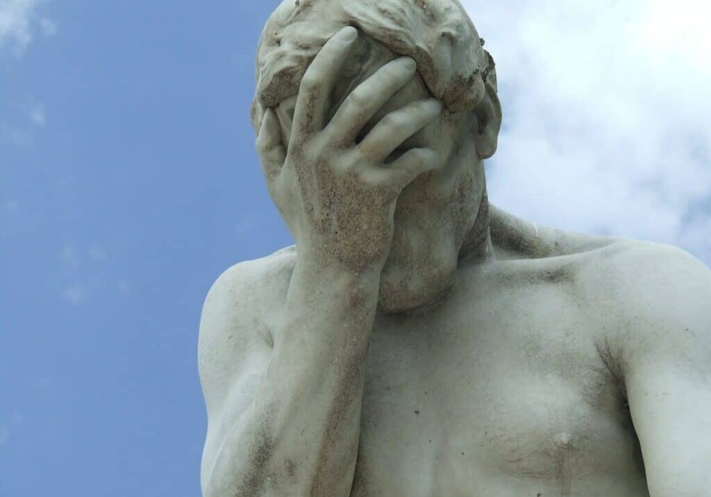 statue holding his head, probably Features and design elements you won’t regret including in a pool